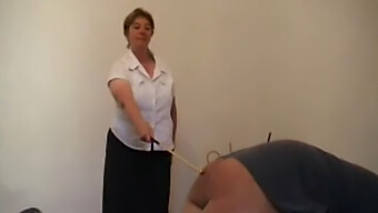 A Mature Woman Uses A Cane On A Man